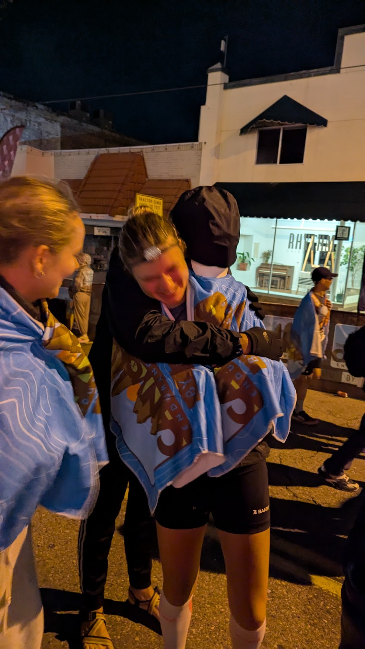 Max and Eliza hugging after Canyons 100K