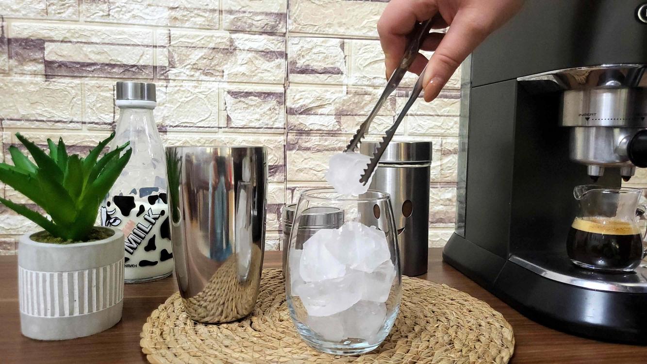 Filling the Glass with Ice Cubes
