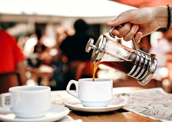 Pouring Coffee from a French Press