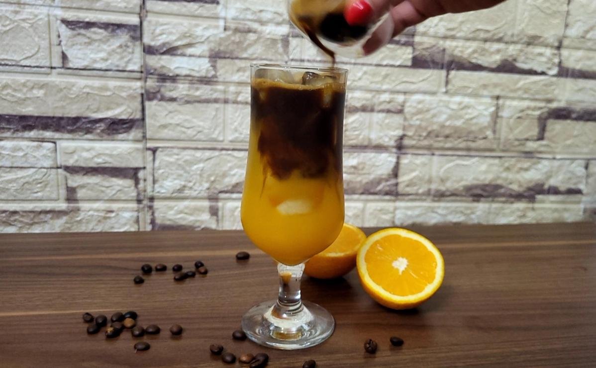 Pouring Espresso on Orange Juice