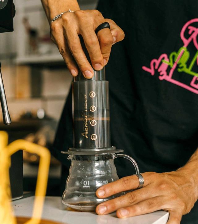 Pressing the Plunger of the AeroPress