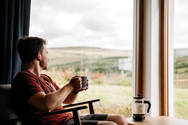 Man Enjoys French Press Coffee