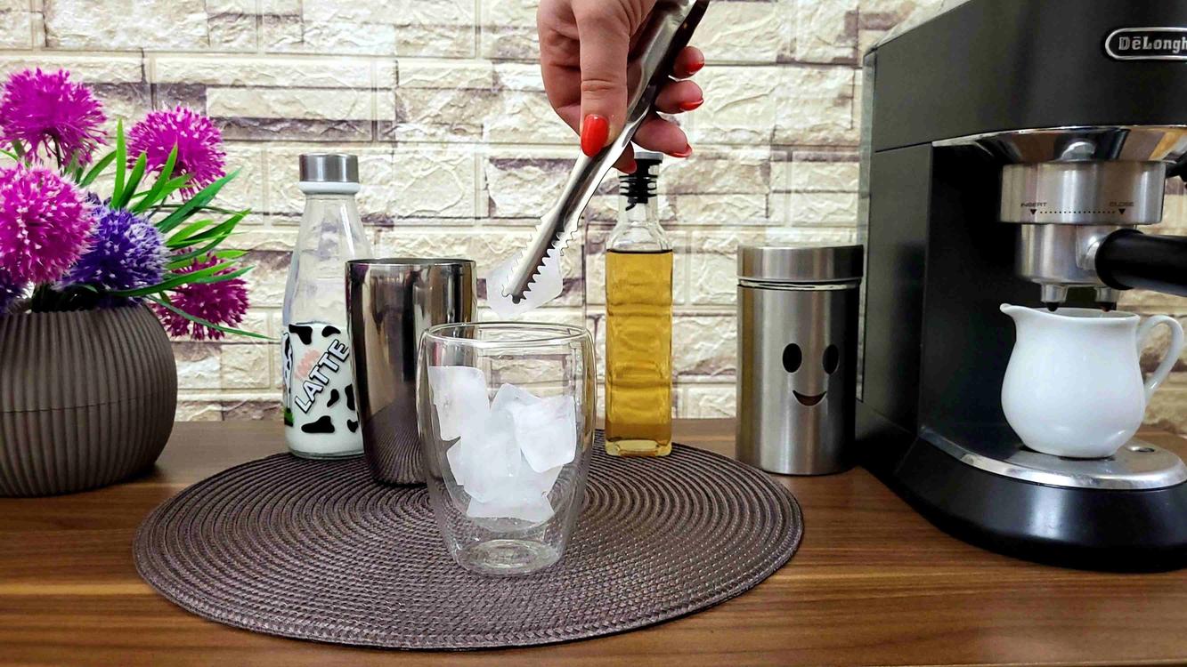 Filling the Glass with Ice Cubes