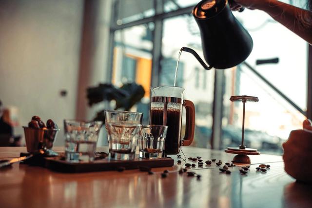 Pouring hot water into French Press