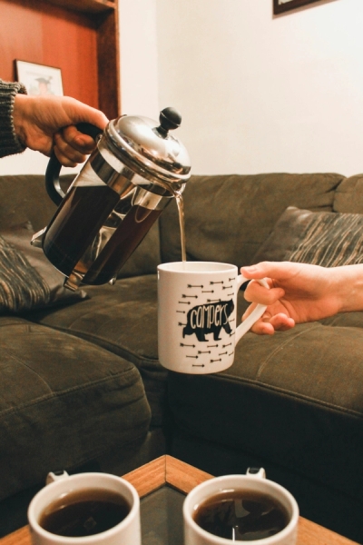 Pouring French press coffee to a Guest