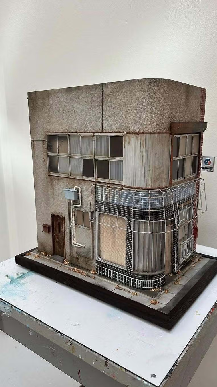 a model of a building with a sign that says no parking