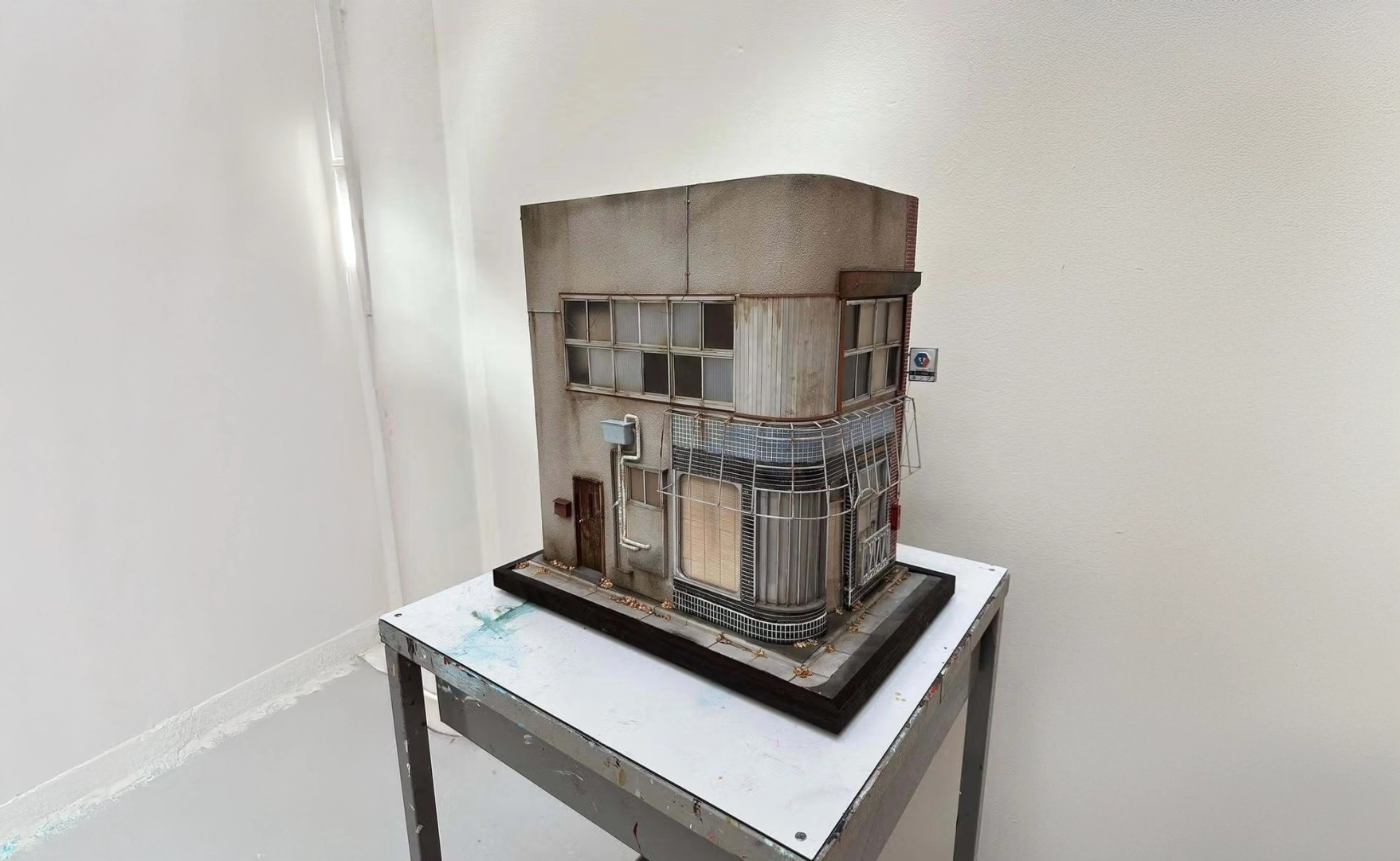 a model of a building with a sign that says no parking