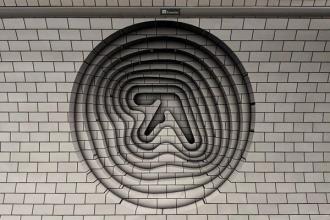 a black and white photo of a circle with the letter a in it .