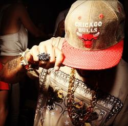 a man wearing a hat that says chicago bulls on it