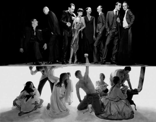 a group of people are standing next to each other in a black and white photo .