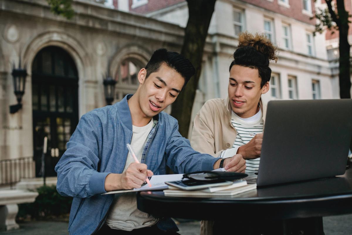 students studying at a table. Learn about programs at McGill University. 