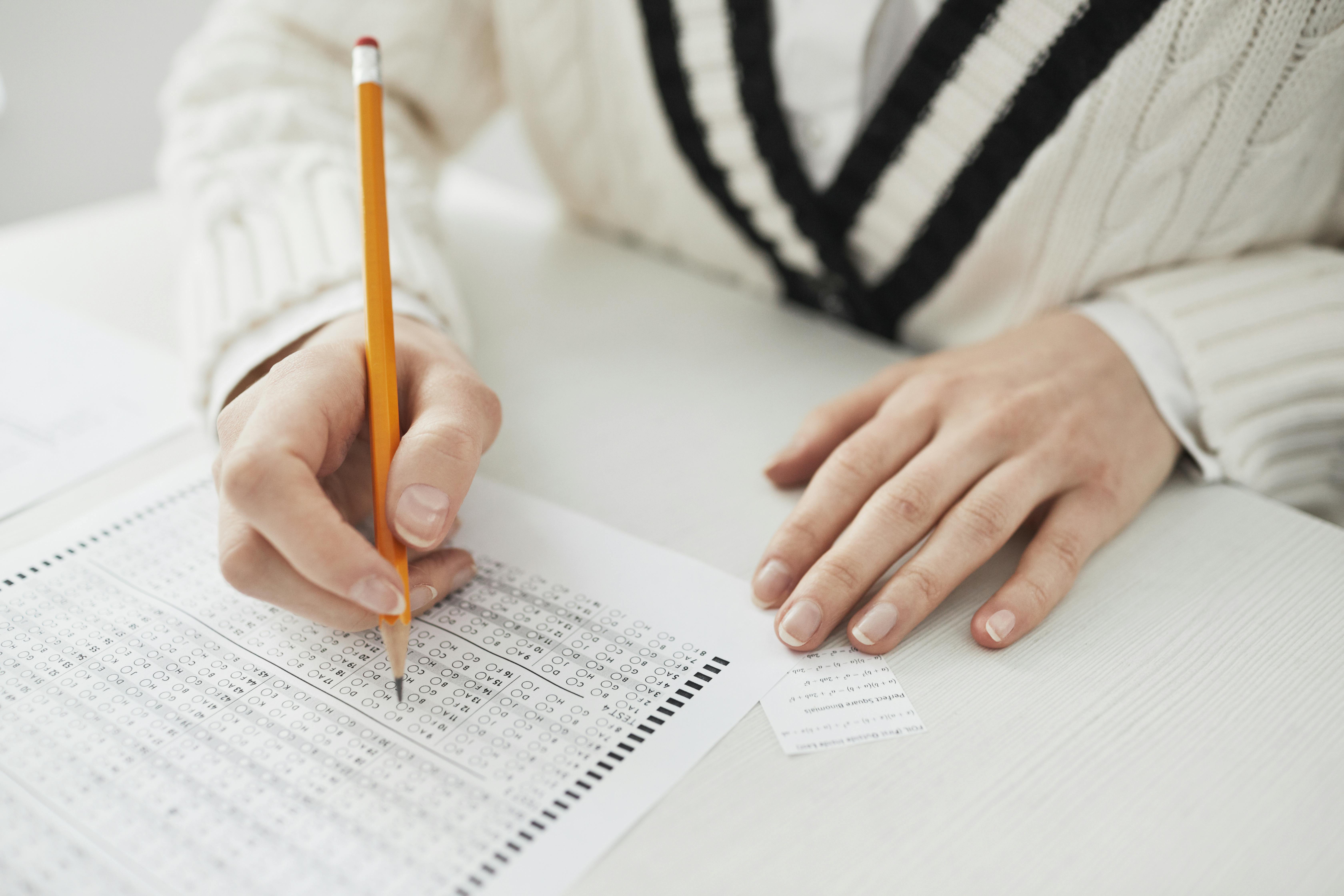 A Person Writing on Paper