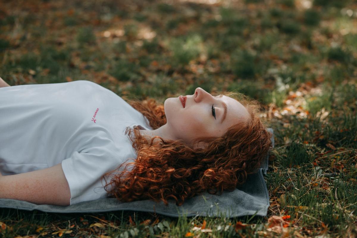 Woman Laying in grass Woman Laying in grass