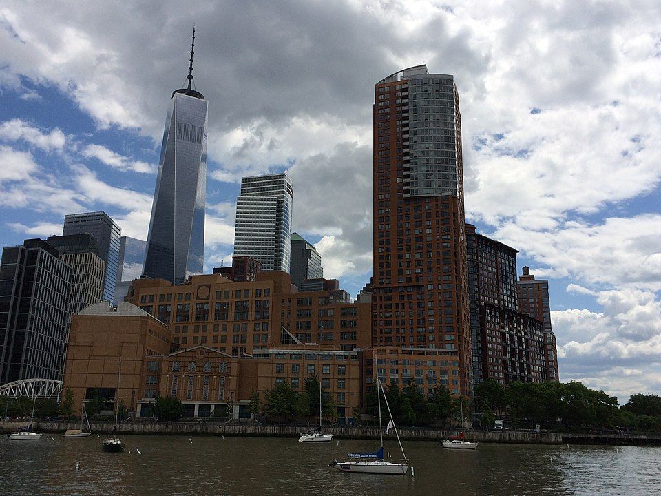 A southward view of Stuyvesant High School from Hudson River Park, with the new World Trade Center in the distance