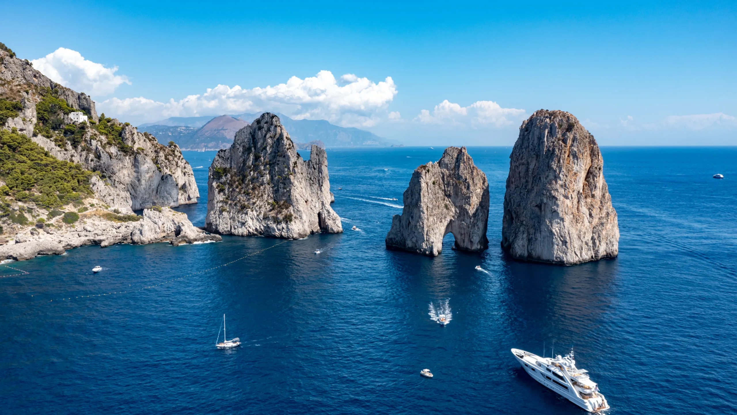 Luxury yacht near the Faraglioni rocks off Capri, Italy