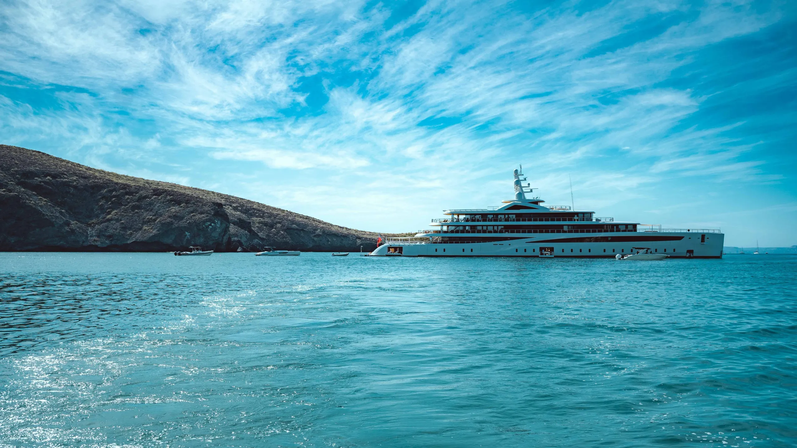 Superyacht cruising in clear turquoise water along the Croatian coast