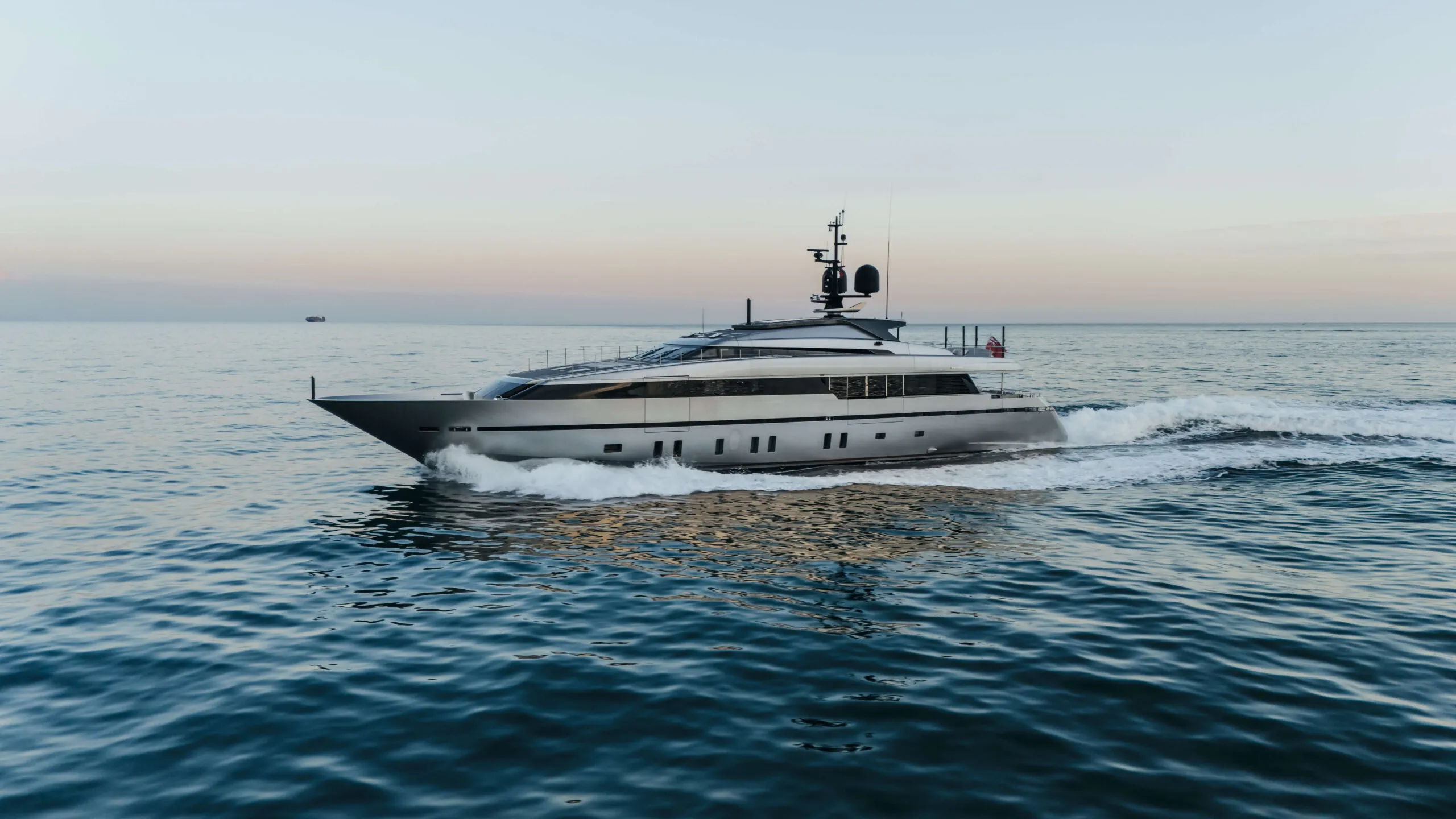 Sanlorenzo 40m yacht cruising across open water, viewed from the side