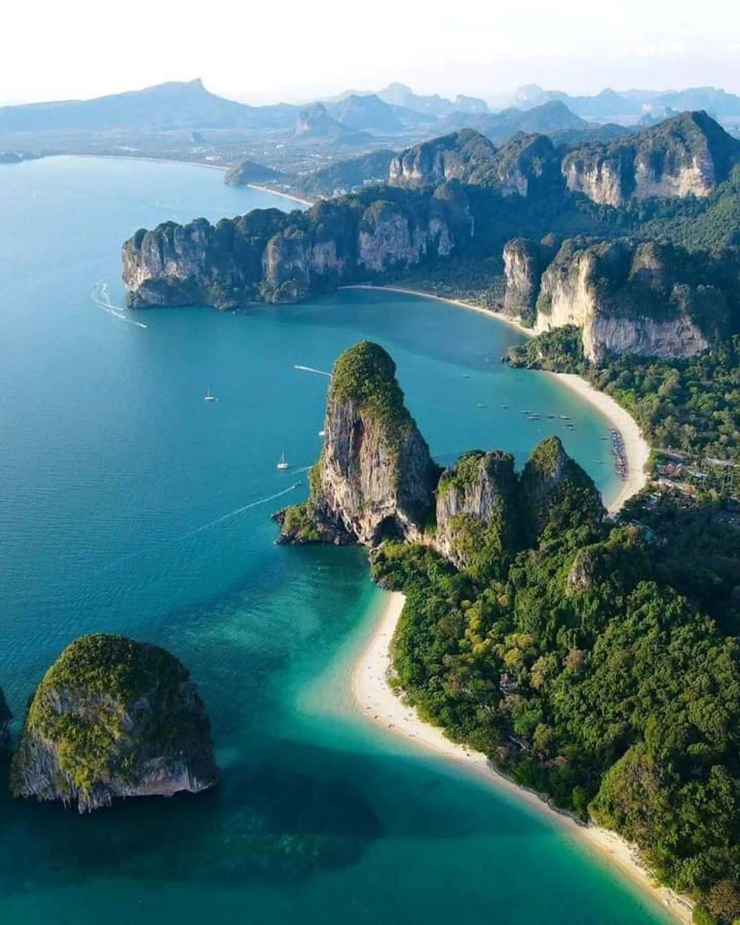 Aerial view of limestone cliffs and turquoise bays in Thailand