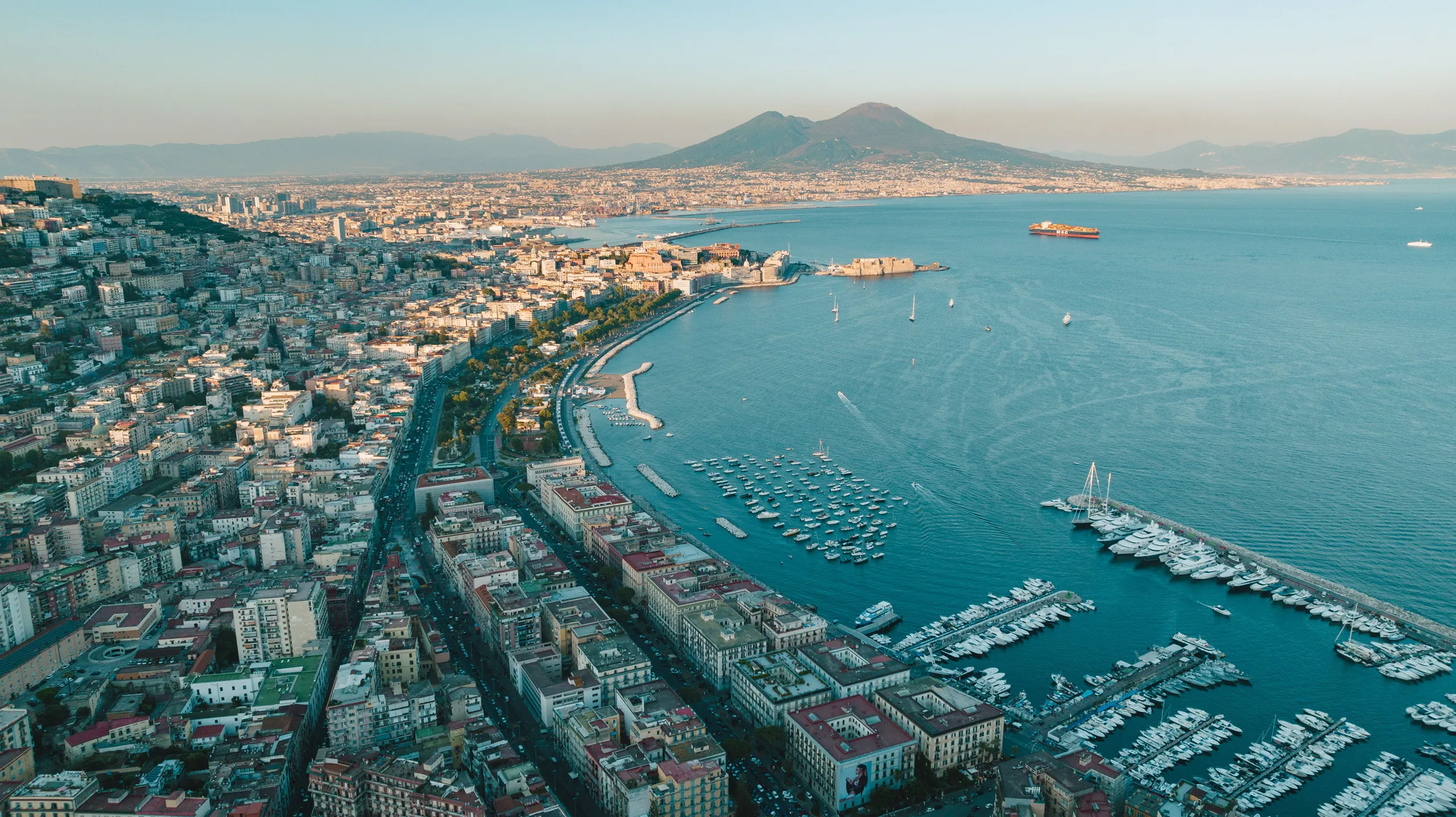Naples harbor and marina with Mount Vesuvius overlooking the Bay of Naples