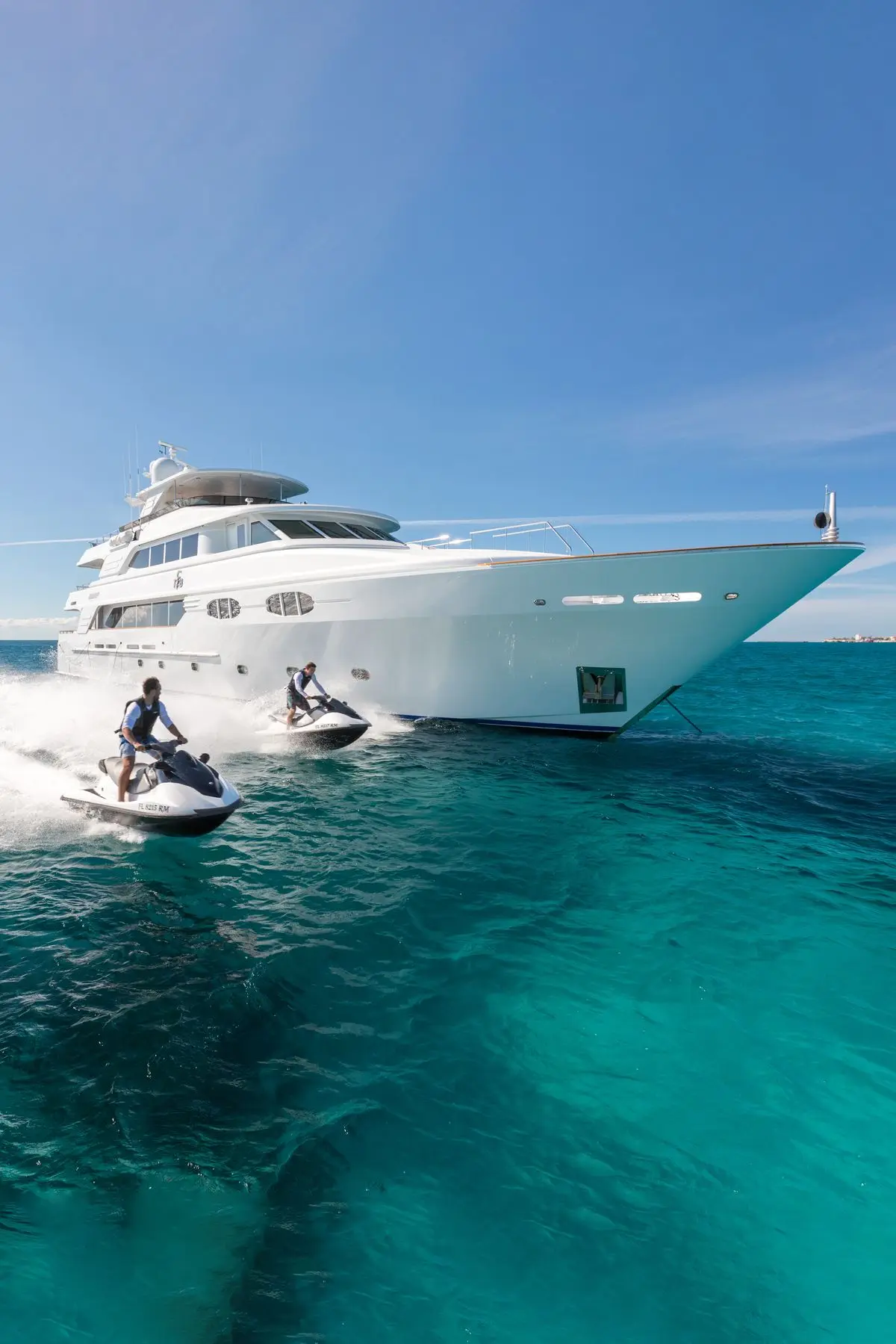 Luxury yacht with jet skis on turquoise Mediterranean water