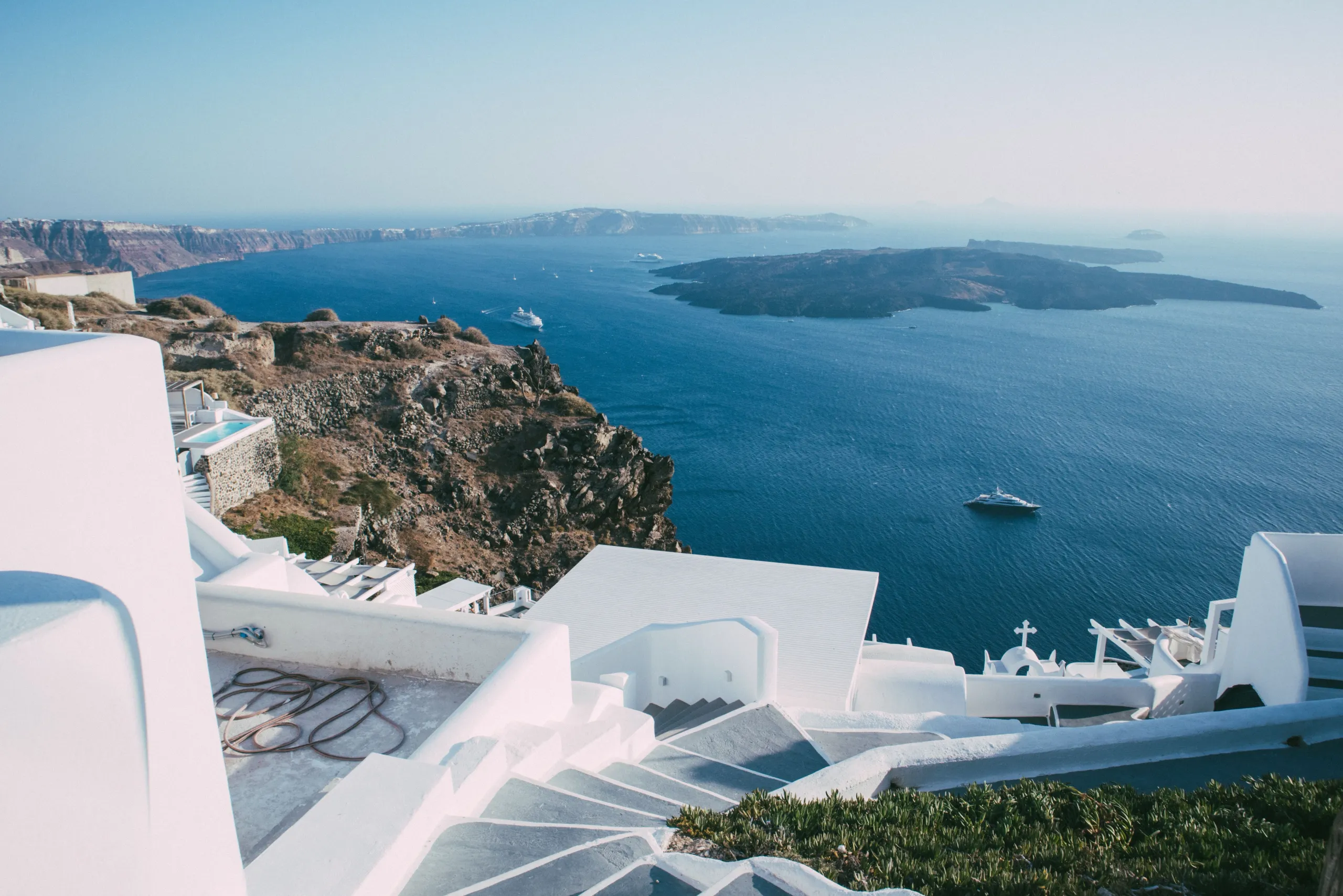 Yacht cruising off Santorini in the Greek Islands