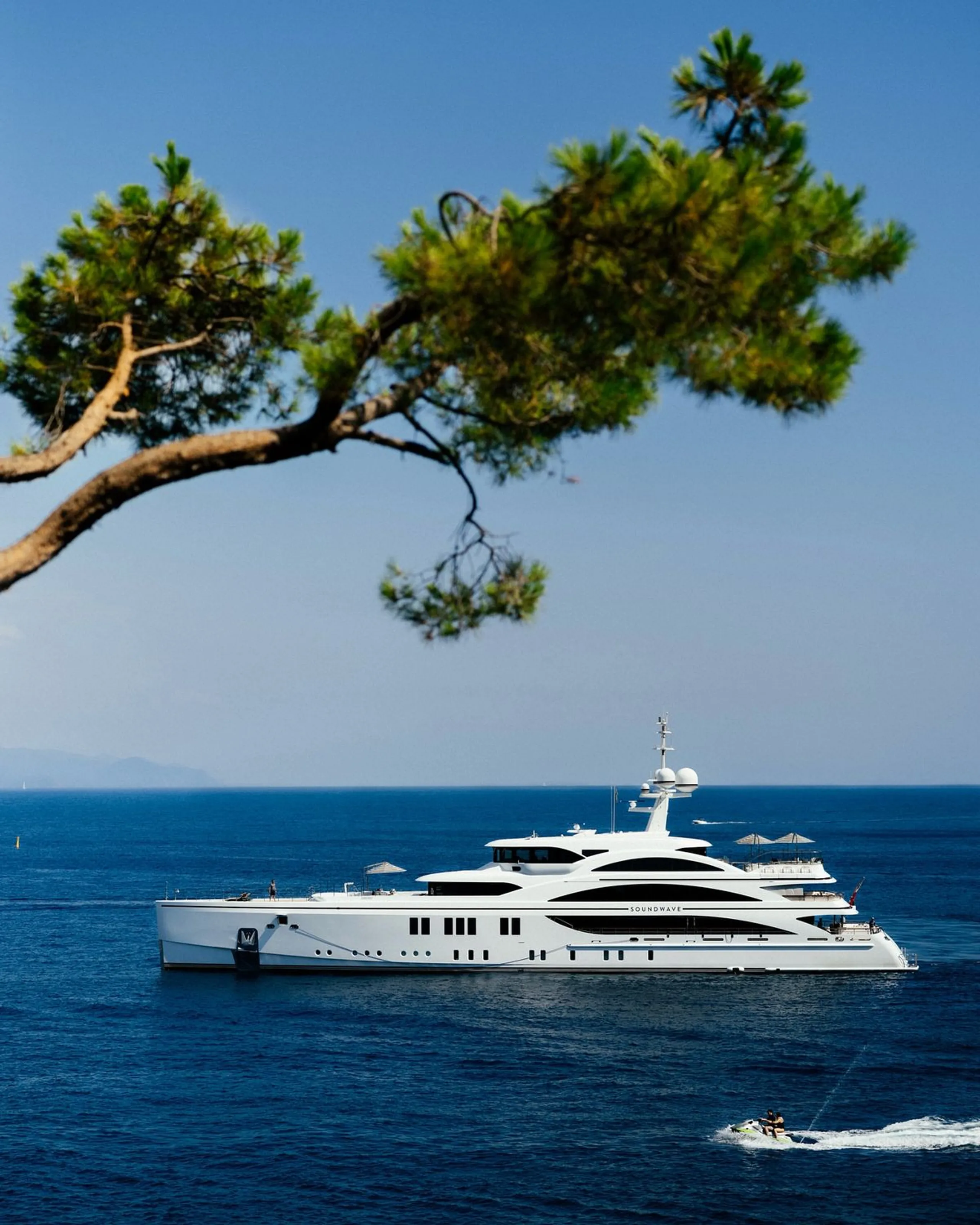Luxury motor yacht cruising along the Mediterranean coast
