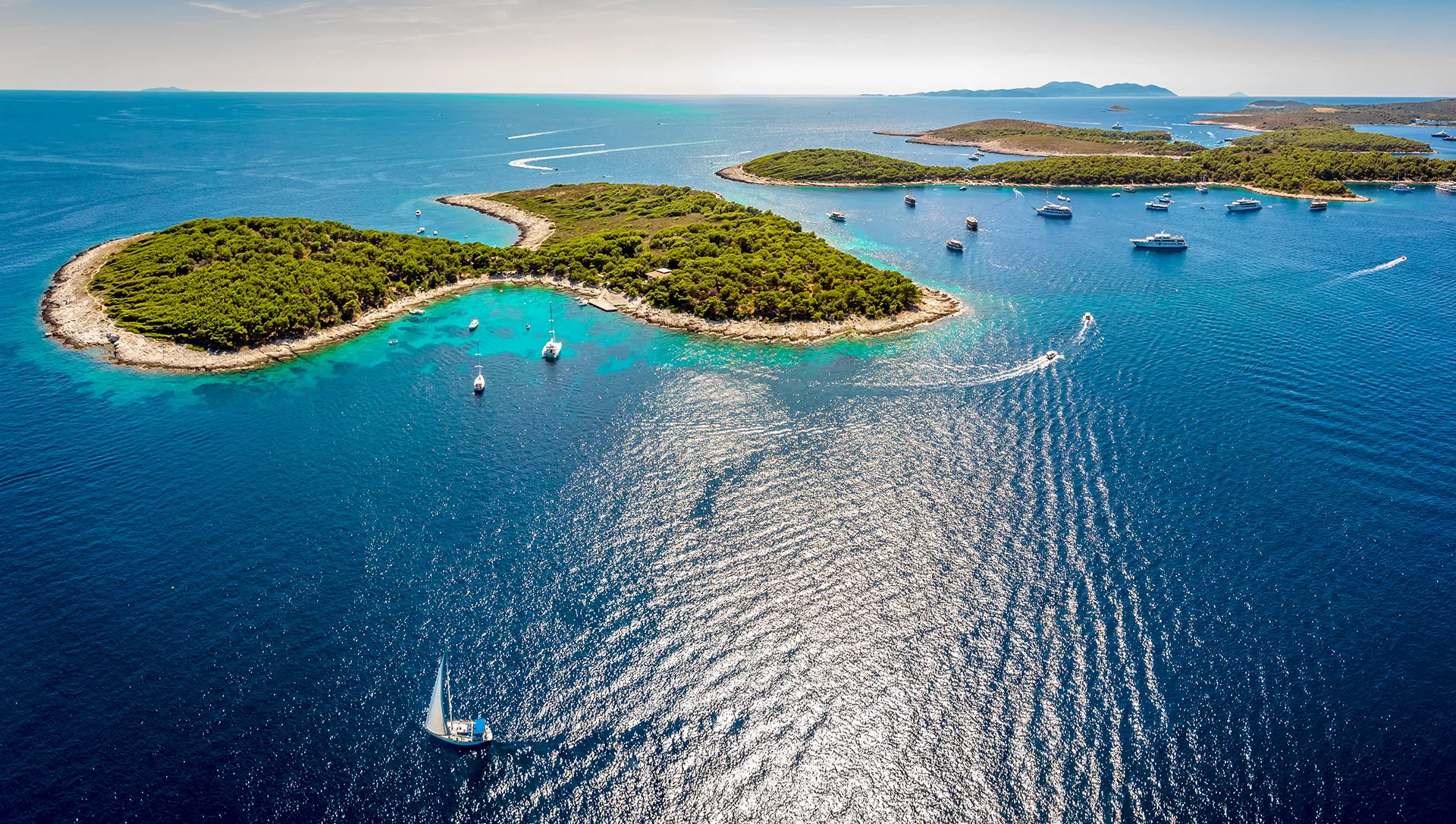 Aerial view of yachts cruising around the islands near Hvar in Croatia