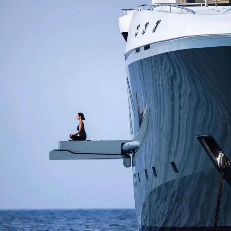 Private yacht owner enjoying a quiet wellness moment at sea