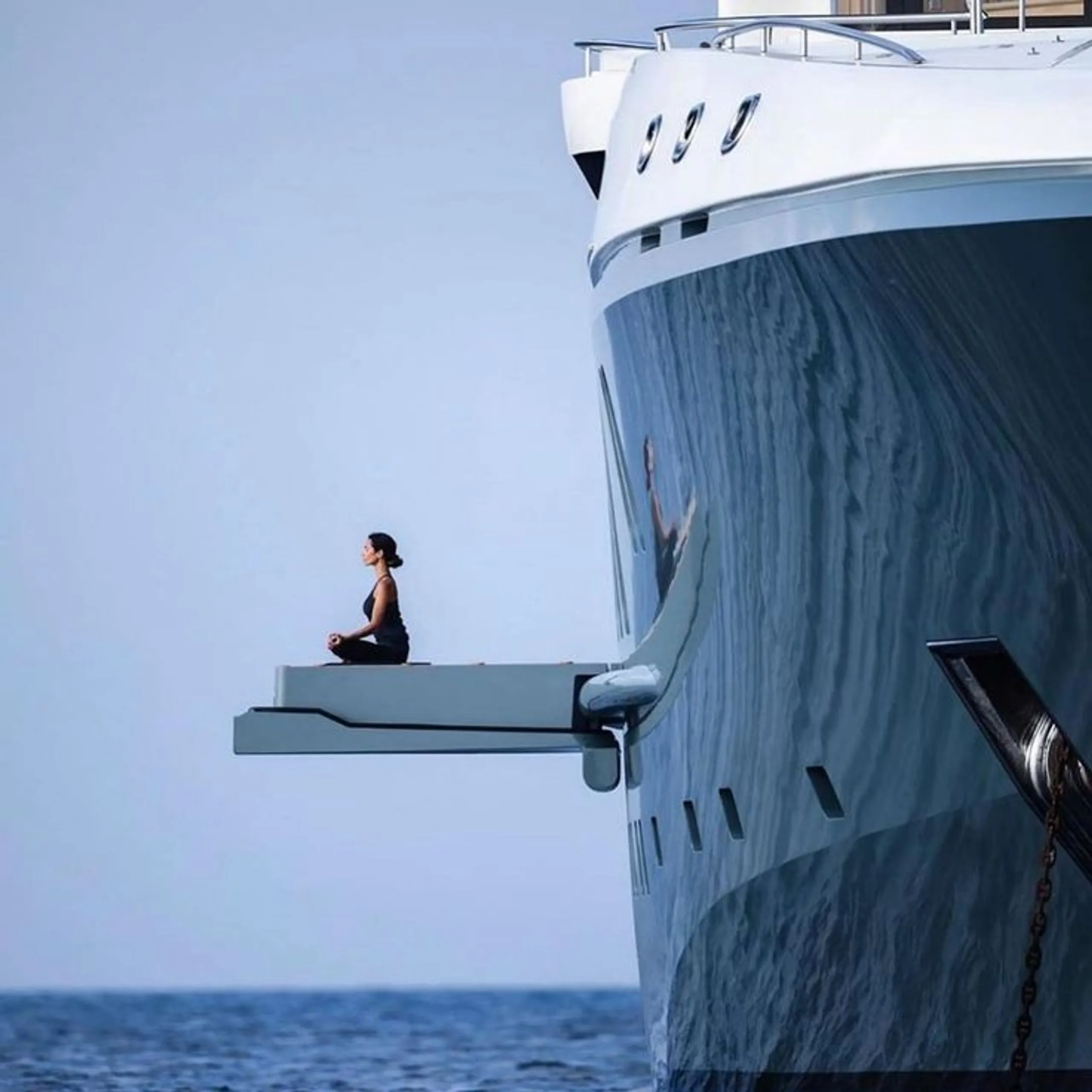 Private yacht owner enjoying a quiet wellness moment at sea