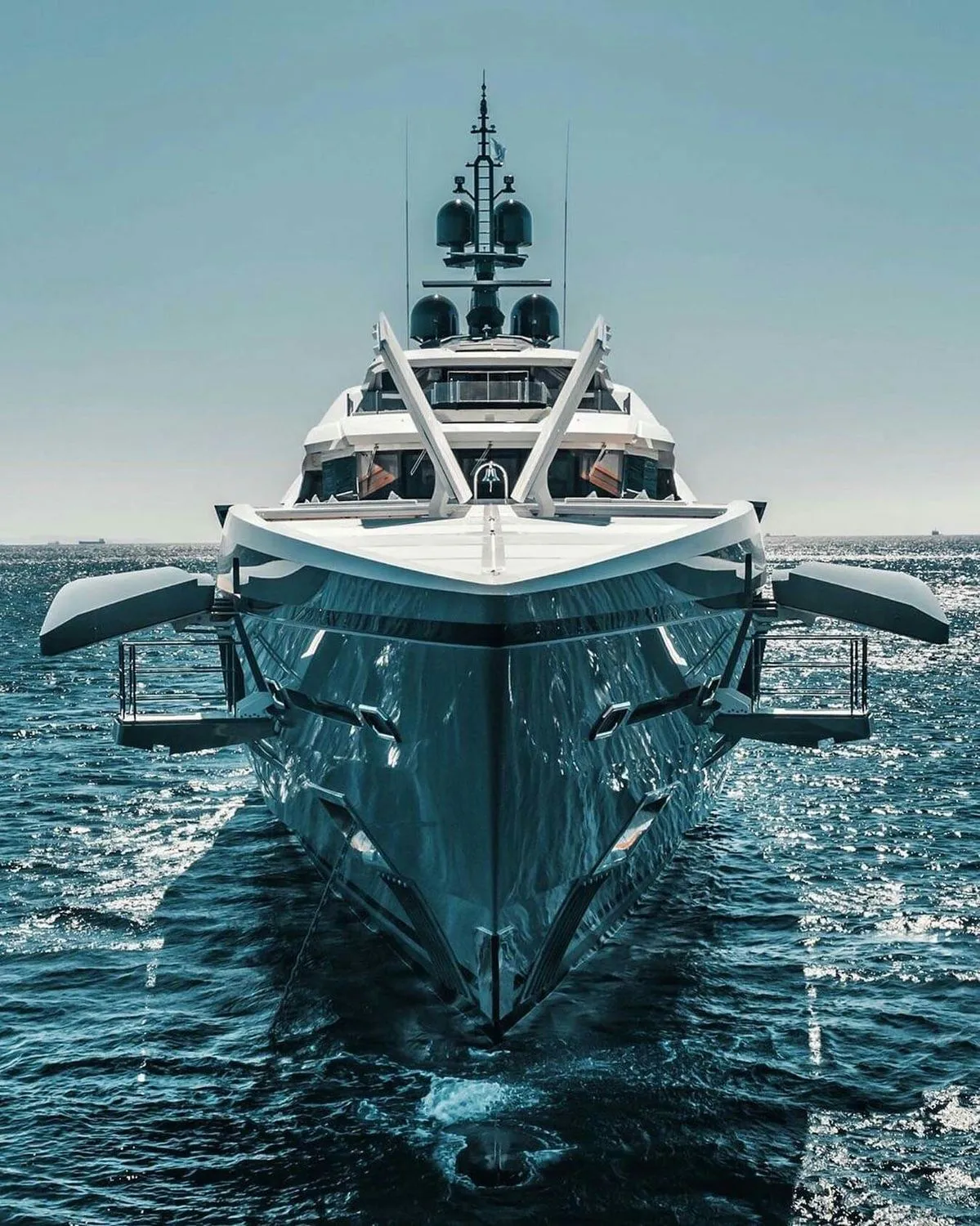 Large superyacht bow underway on open water