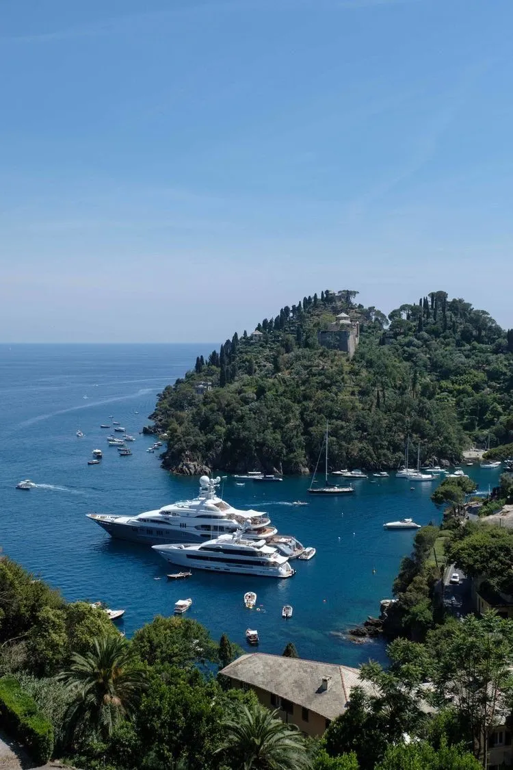 Motor yacht anchored in a sheltered Mediterranean bay