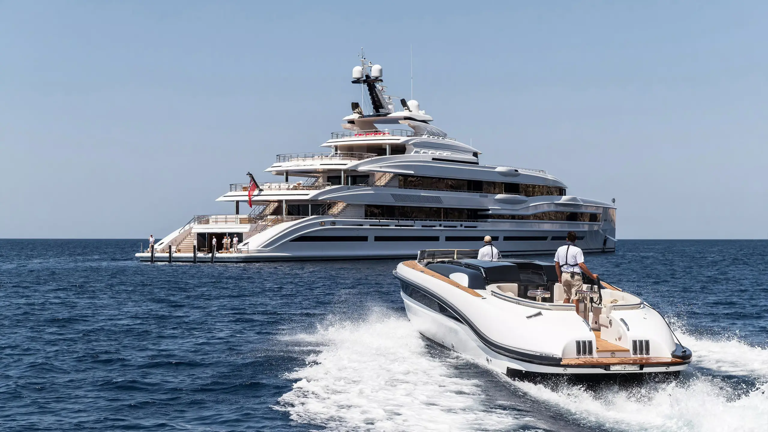 Tender approaching a superyacht at sea