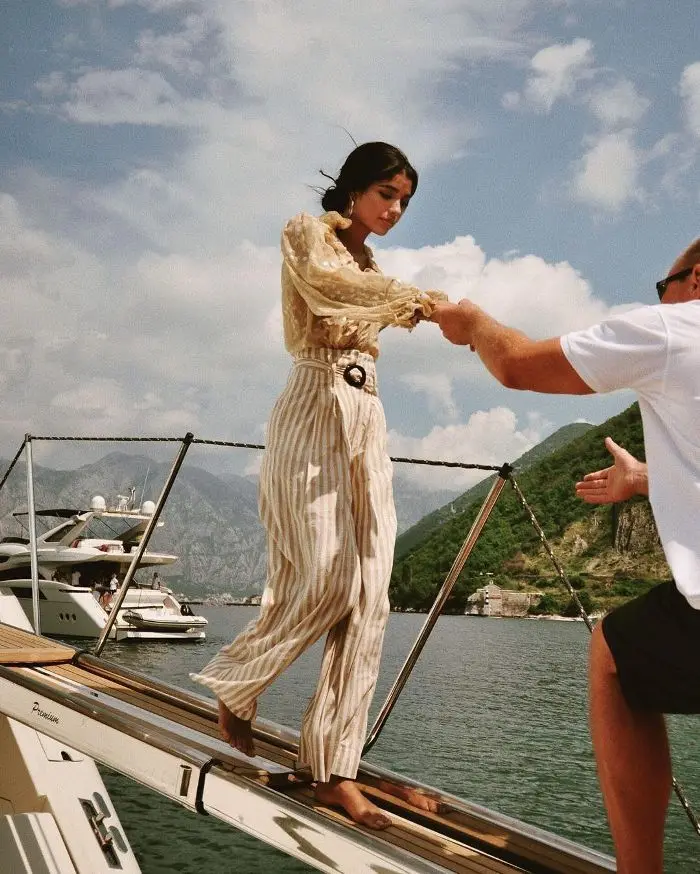 Guest being assisted while boarding a private yacht