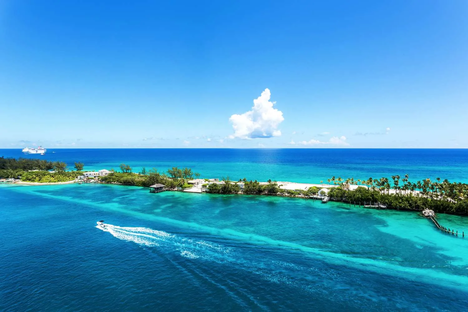 Boat cruising over turquoise waters near Nassau in the Bahamas