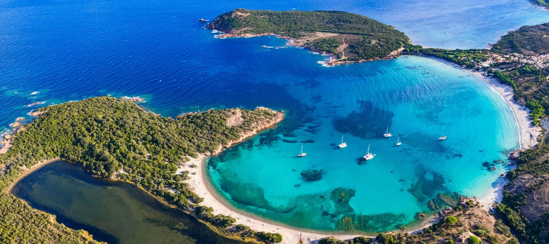 Sailing yachts anchored in Rondinara Bay on the southern coast of Corsica