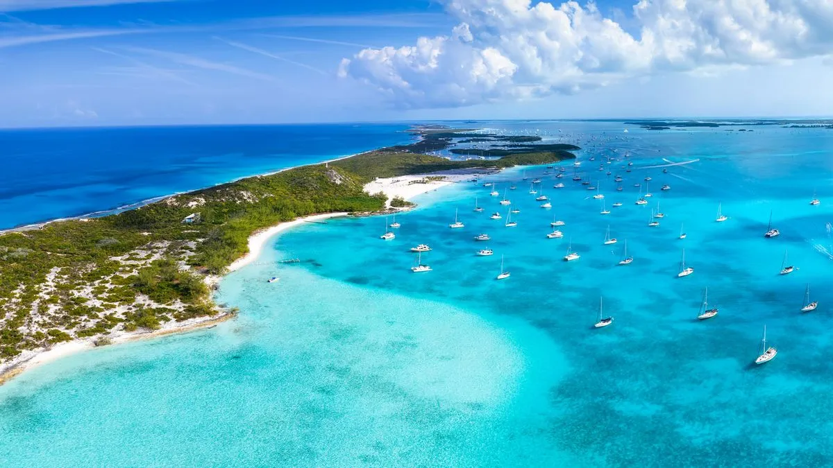 Aerial view of turquoise waters, sandbanks and yachts in the Exumas, Bahamas