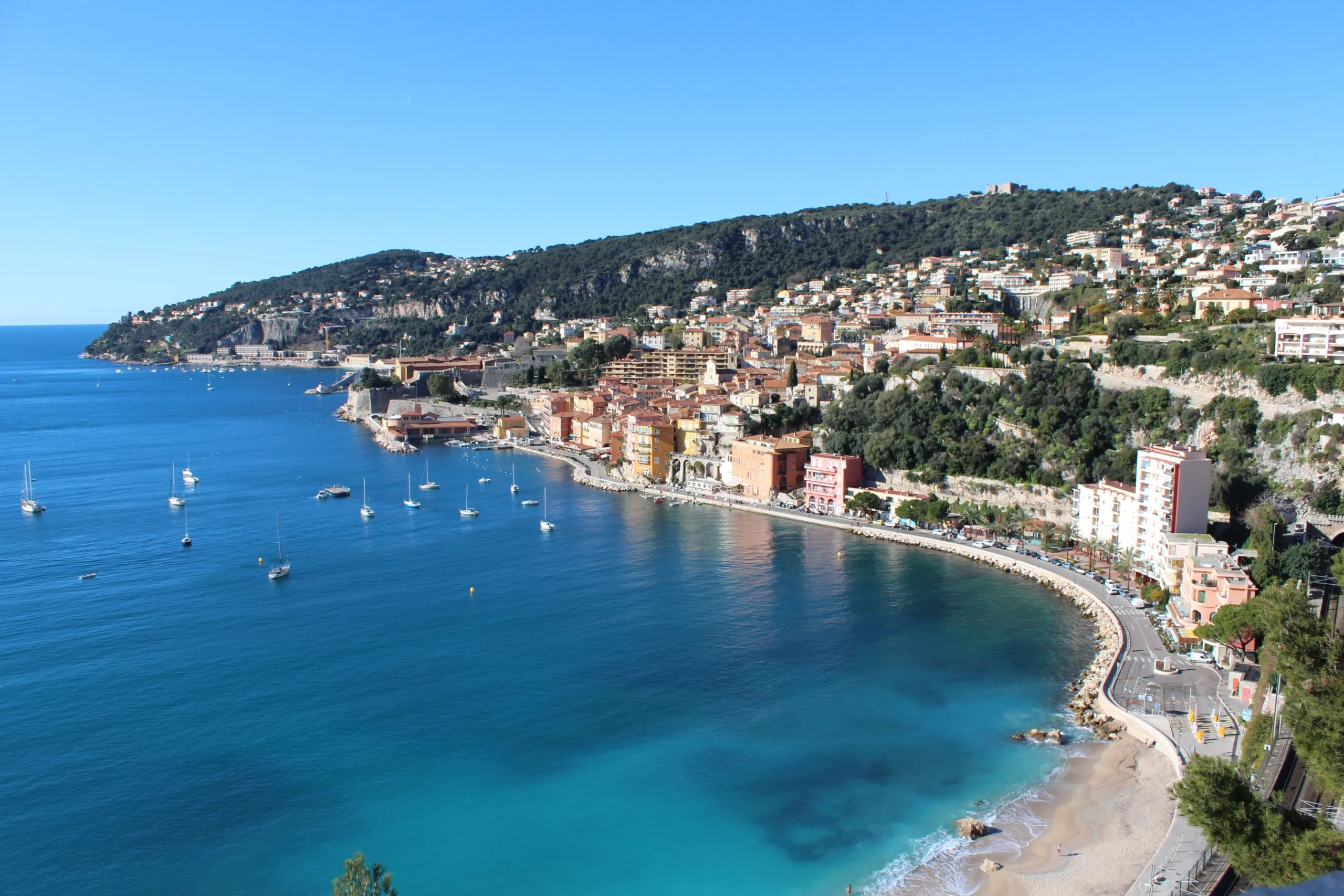 Sailing boats anchored along the French Riviera coastline