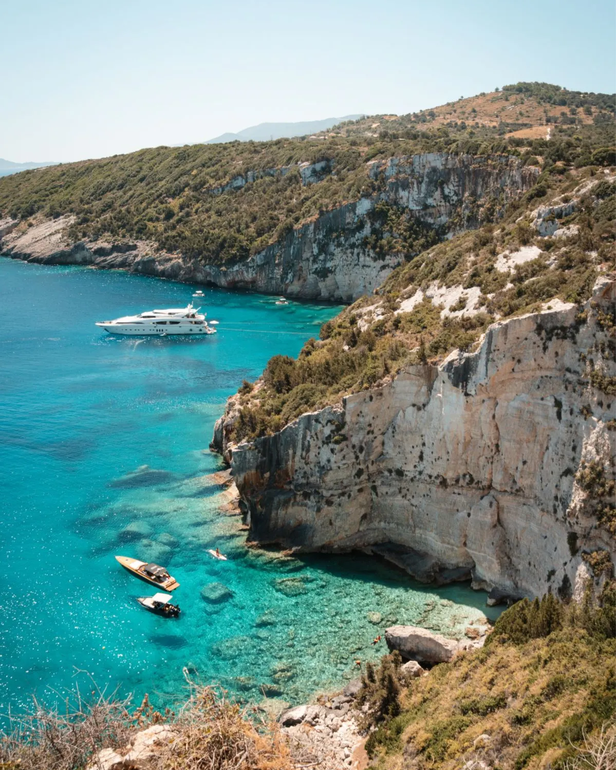 Yacht anchored in a turquoise Mediterranean cove