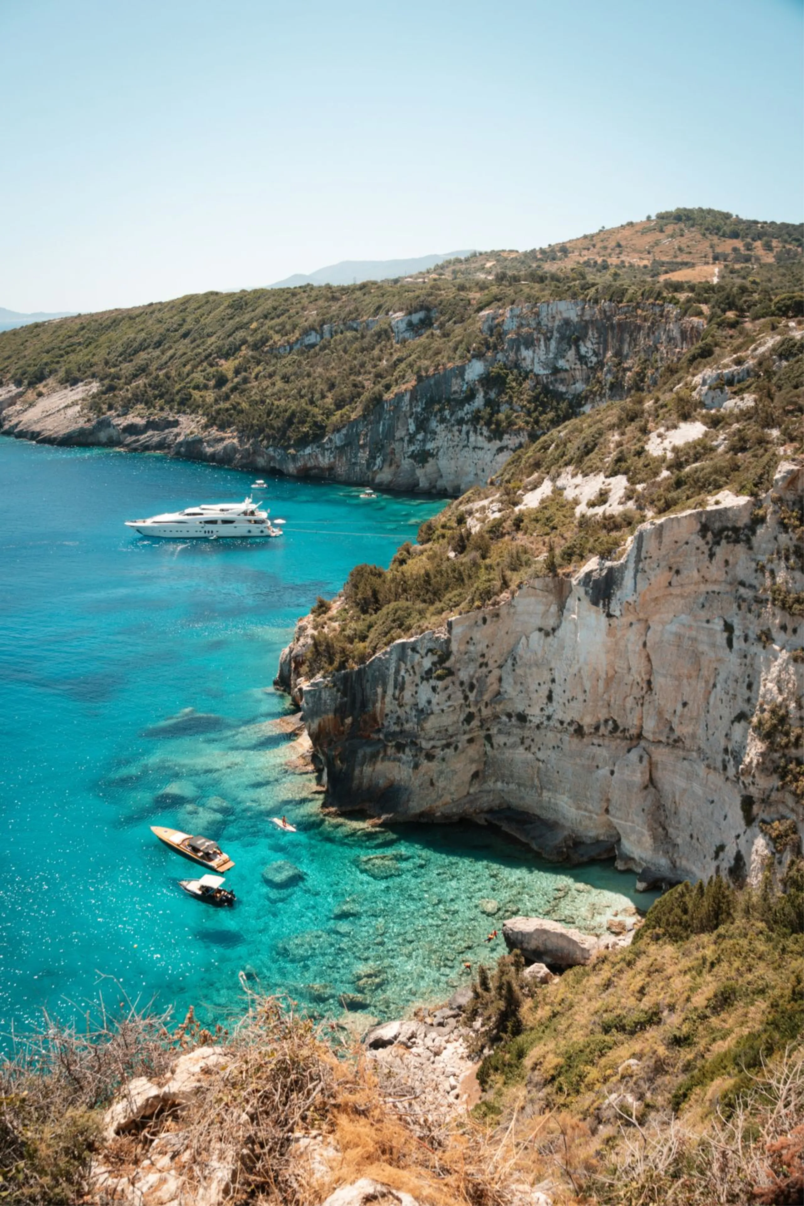 Yacht anchored in a turquoise Mediterranean cove