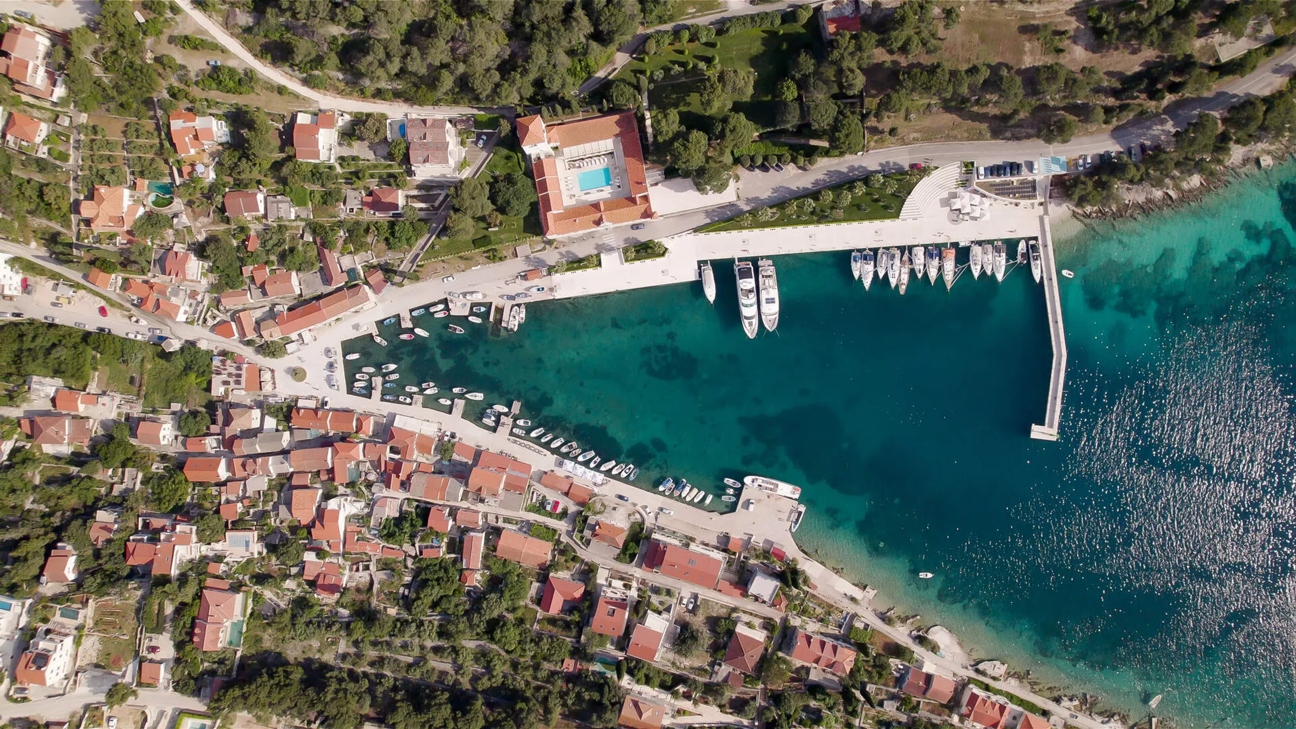 Aerial view of a marina and coastal village on the Dalmatian coast of Croatia