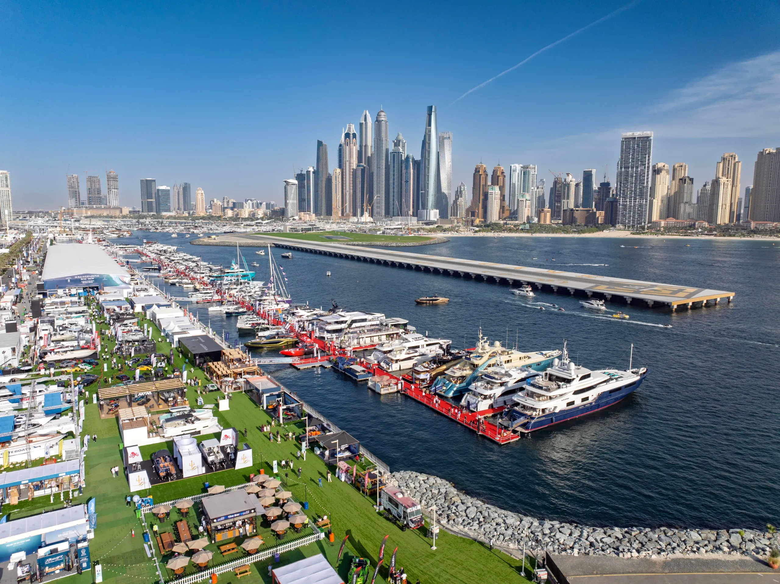 Dubai International Boat Show at Dubai Harbour with superyachts and Dubai Marina skyline