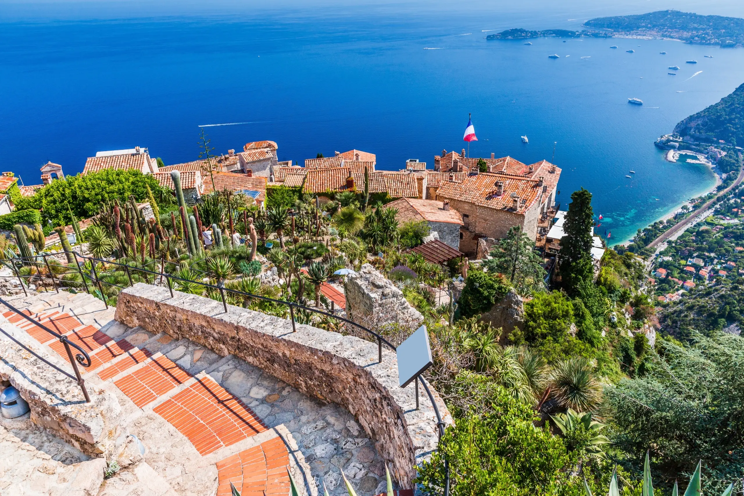 Aerial view of the French Riviera coastline with yachts at anchor in the bay