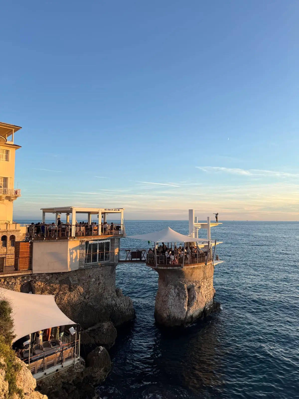 Seaside restaurant terrace in Nice at sunset