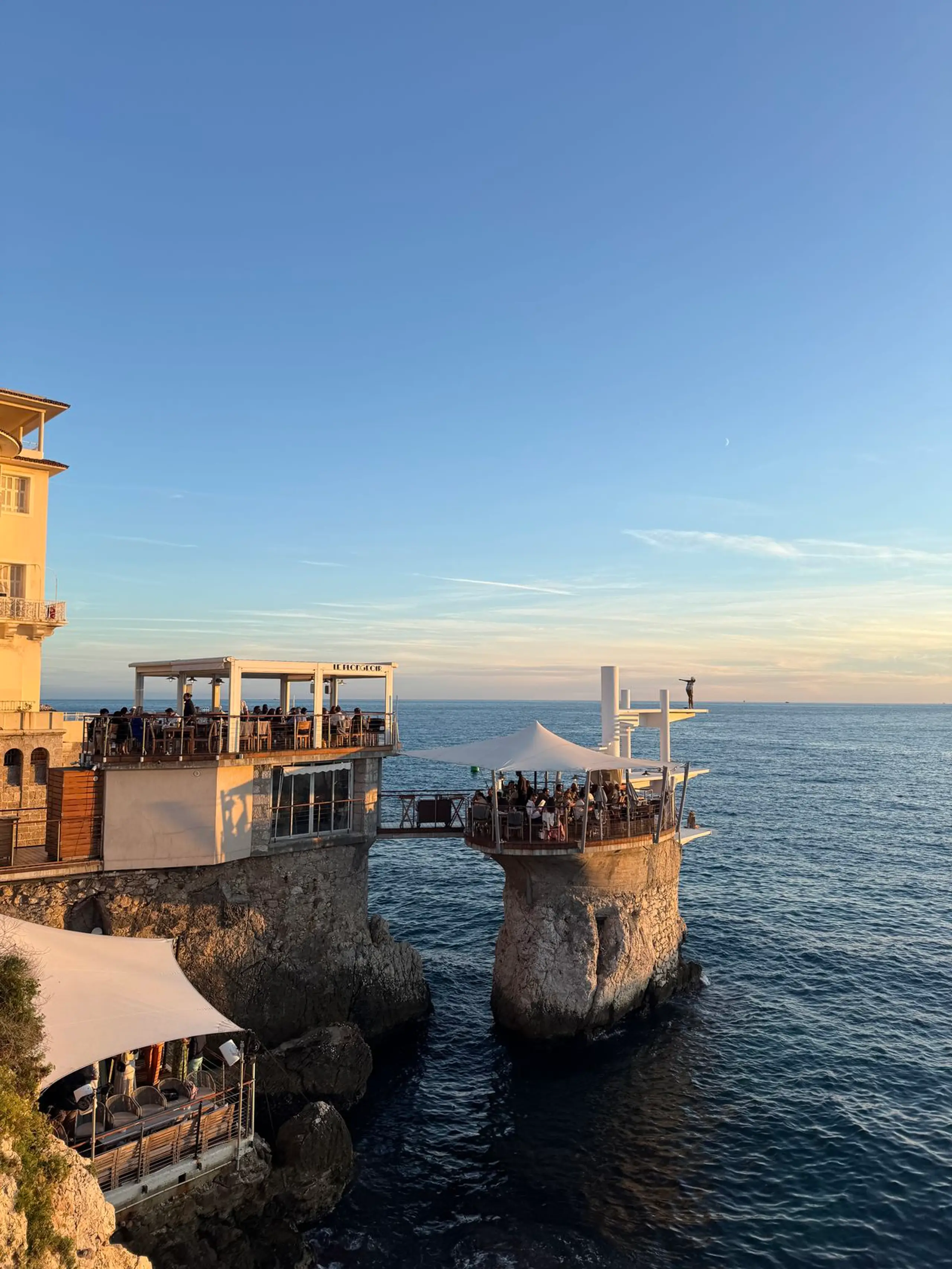 Seaside restaurant terrace in Nice at sunset