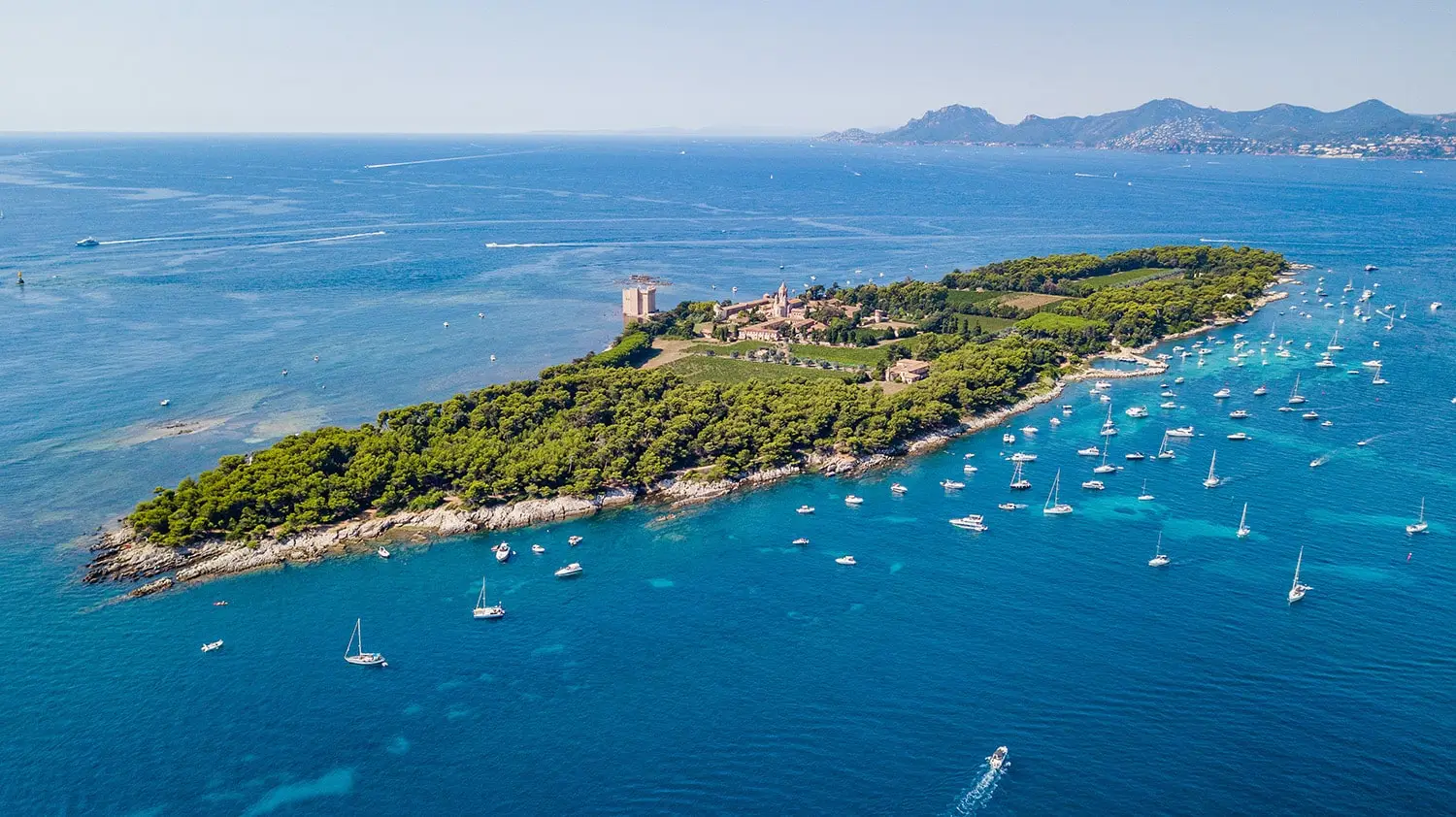 Sainte Marguerite Island near Cannes with yachts anchored along the French Riviera coastline