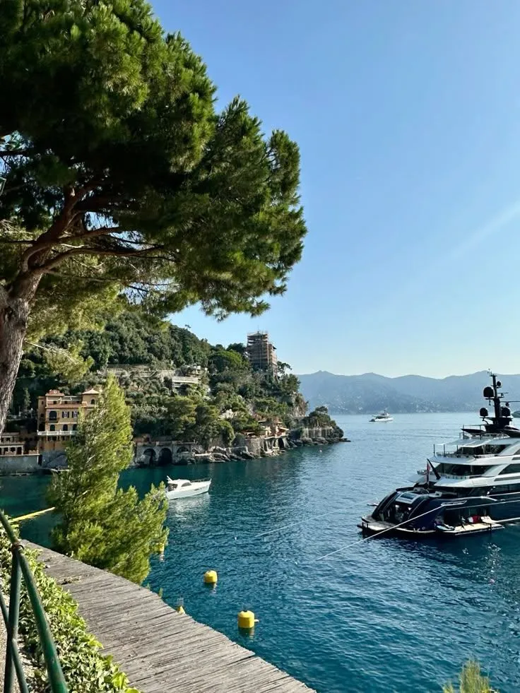 Luxury yachts anchored along the Riviera coastline, reflecting Balthazar Yachting’s global network and destination expertise.