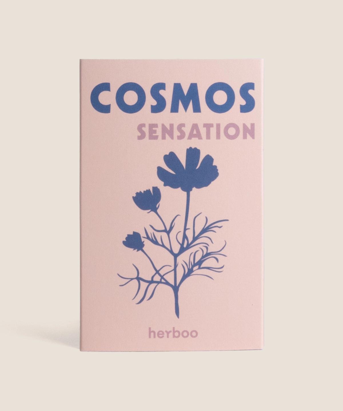 Herboo Cosmos ‘Sensation’ seed packet with illustrated pink and white daisy-like cosmos flowers on a clean background.