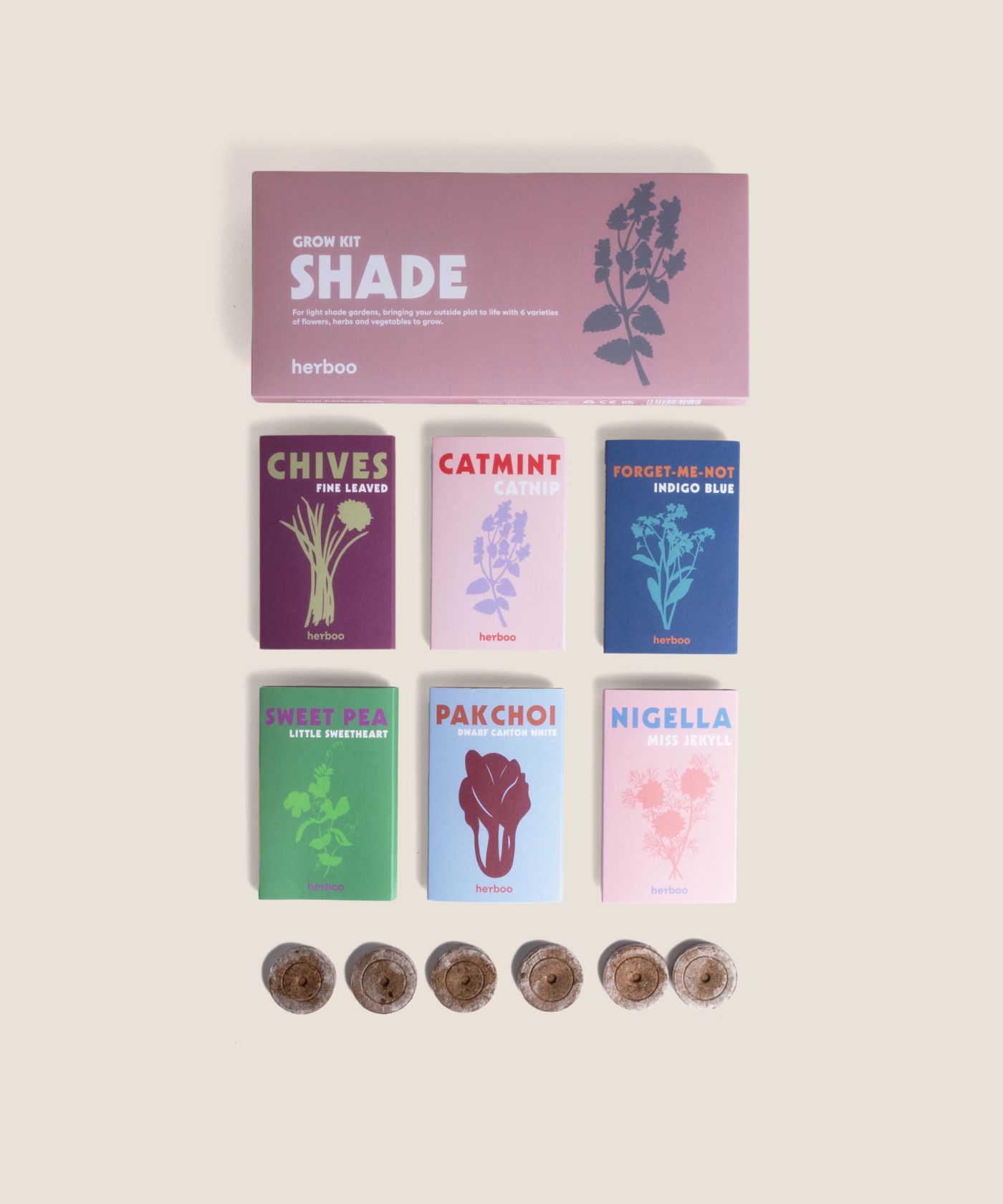 Flat-lay of the Shade Garden Grow Box with shade-loving flower and herb seed packets.