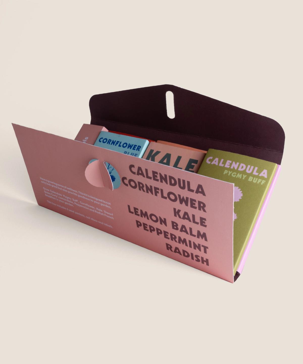 Wellness Garden Seed Box opened to show seed packets and contents inside.