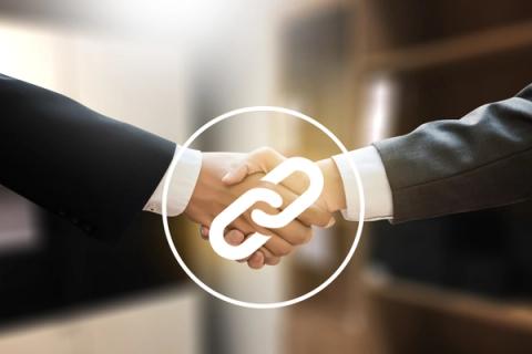 Two enterprise-level businessmen shaking hands with link building strategy symbol